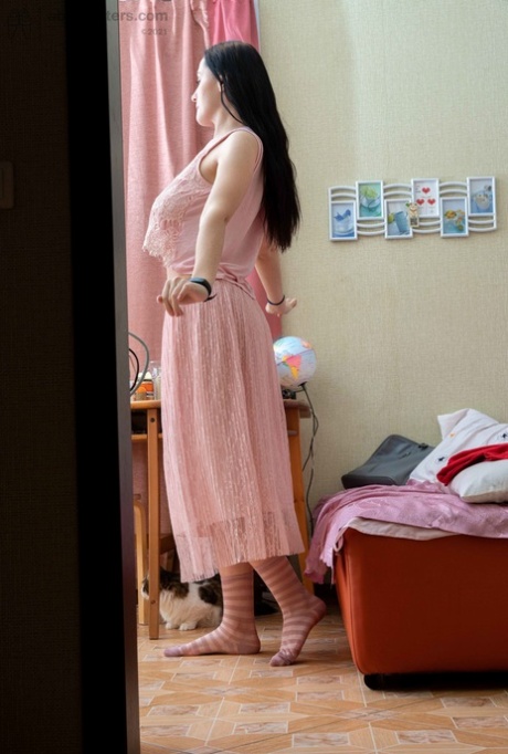 Tall brunette Elza flashing her tight ass & her large areolas while dressiing