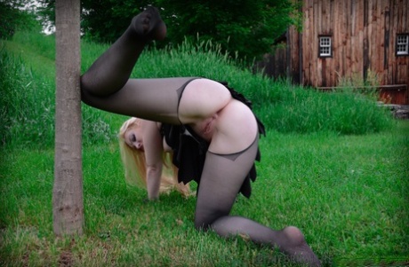 Blonde female Delirious Hunter is restrained in a variety of ways